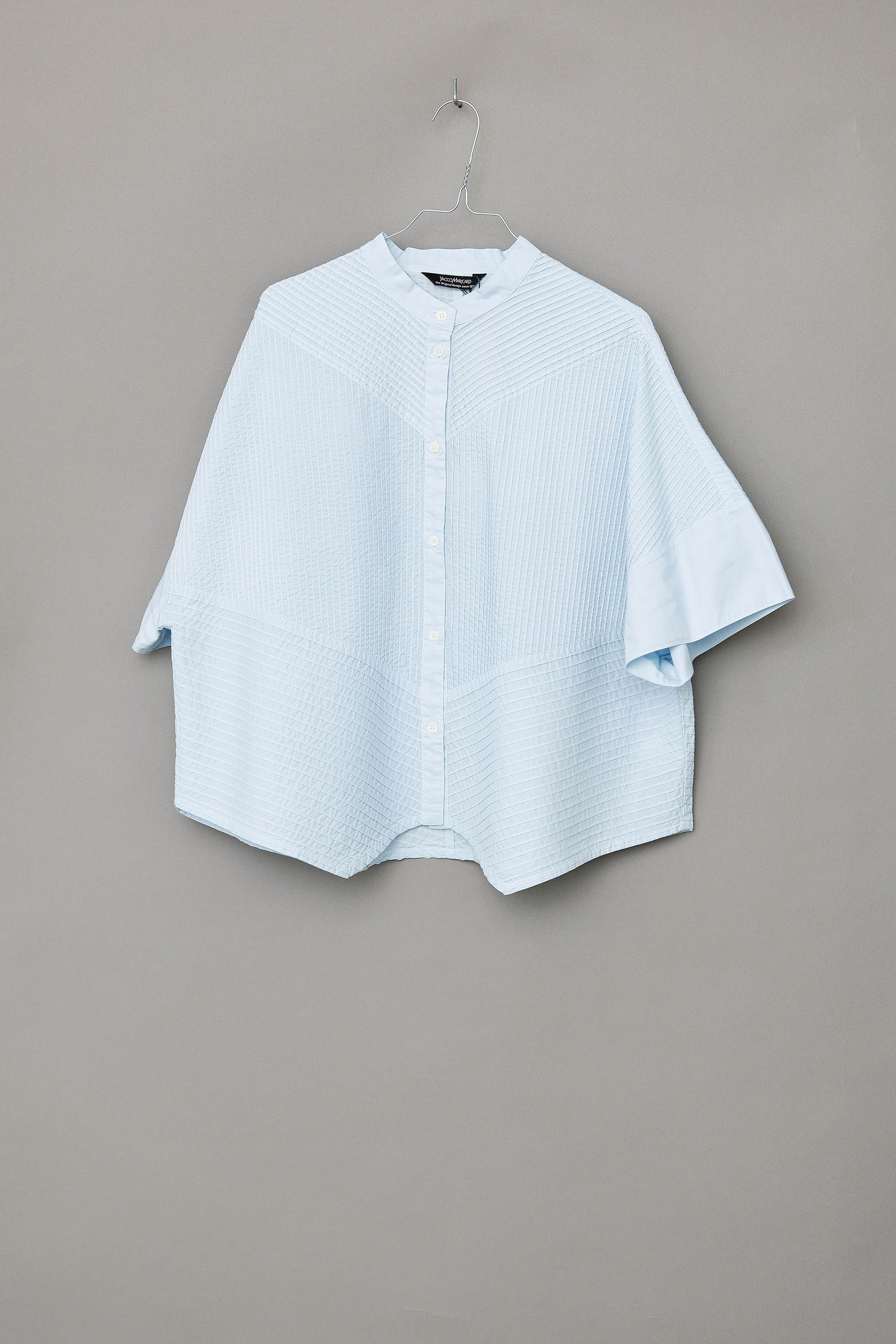 Ice blue short-sleeved, feminine YaccoMaricard shirt.
