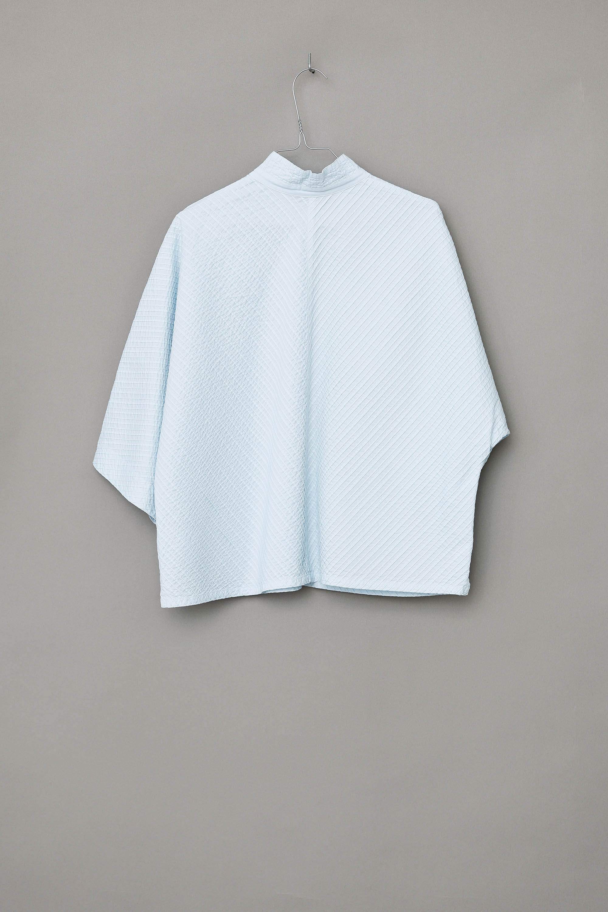 Ice blue YaccoMaricard shirt with batwing sleeves.