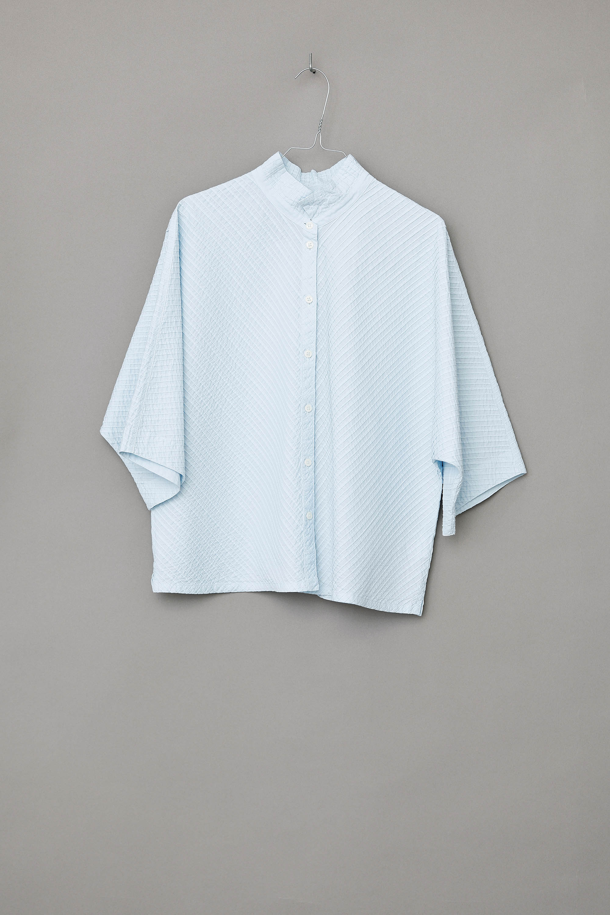 Ice blue YaccoMaricard shirt with batwing sleeves.