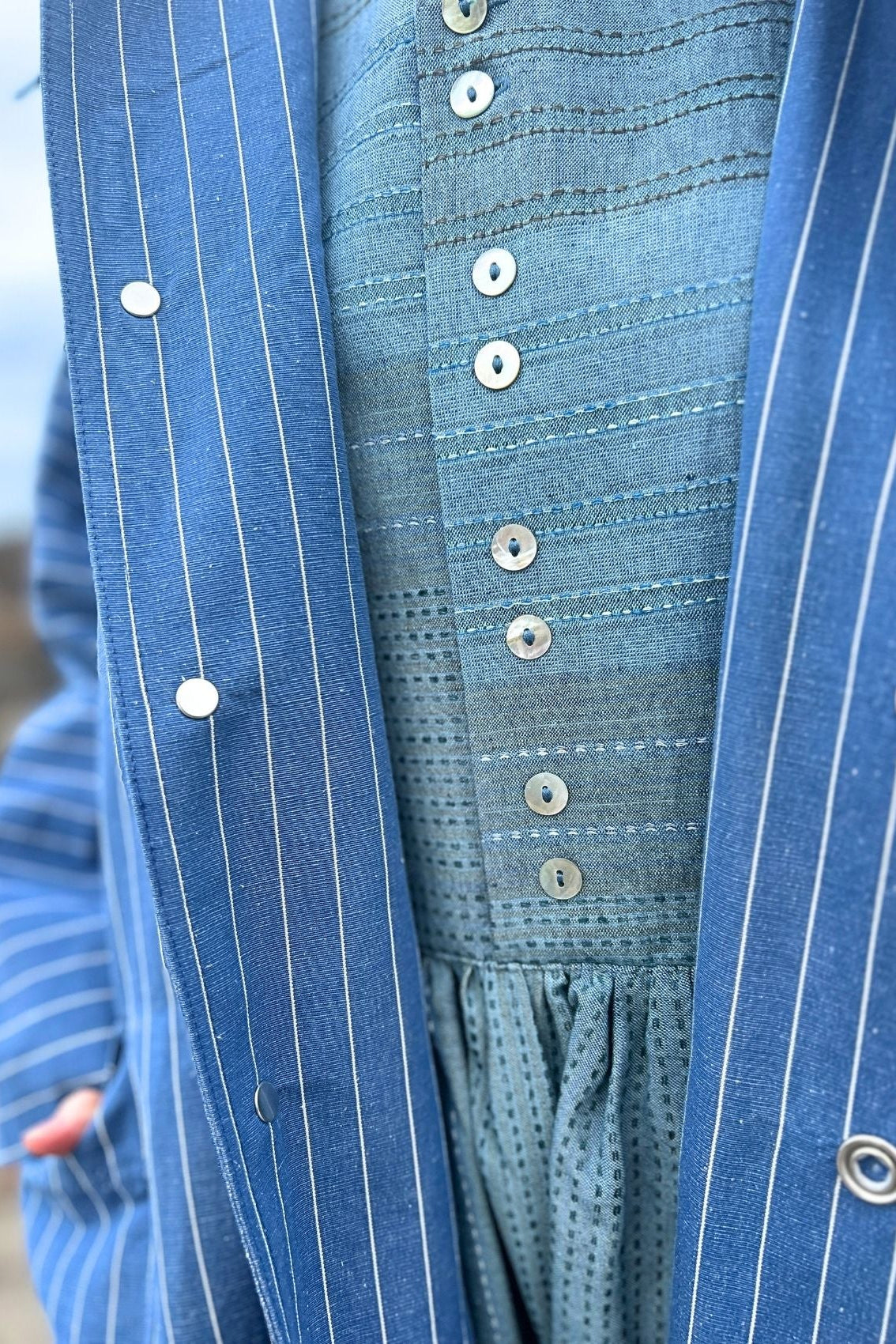 Cool, striped spring coat in blue linen/cotton quality
