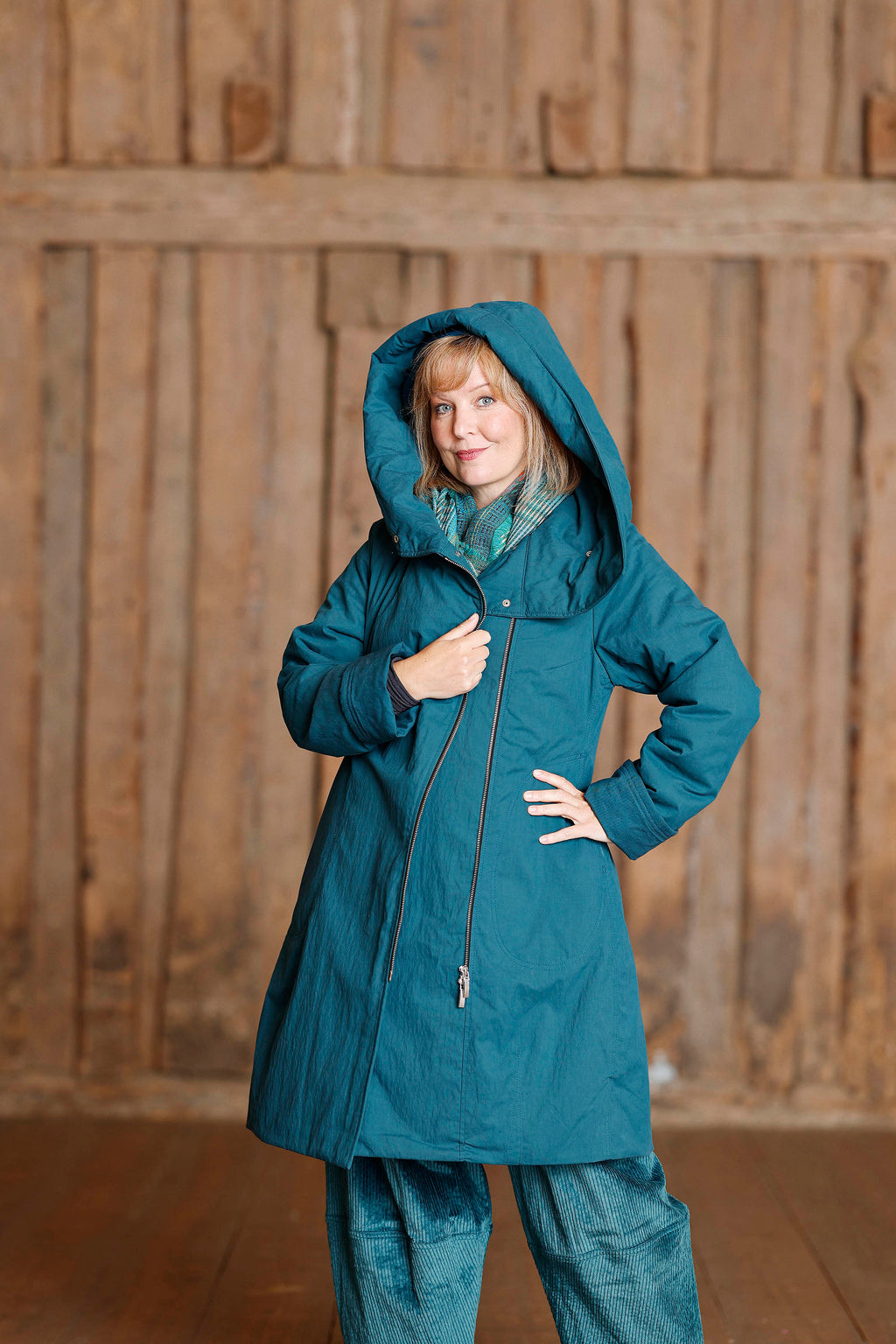 Petrol coat with asymmetric zipper
