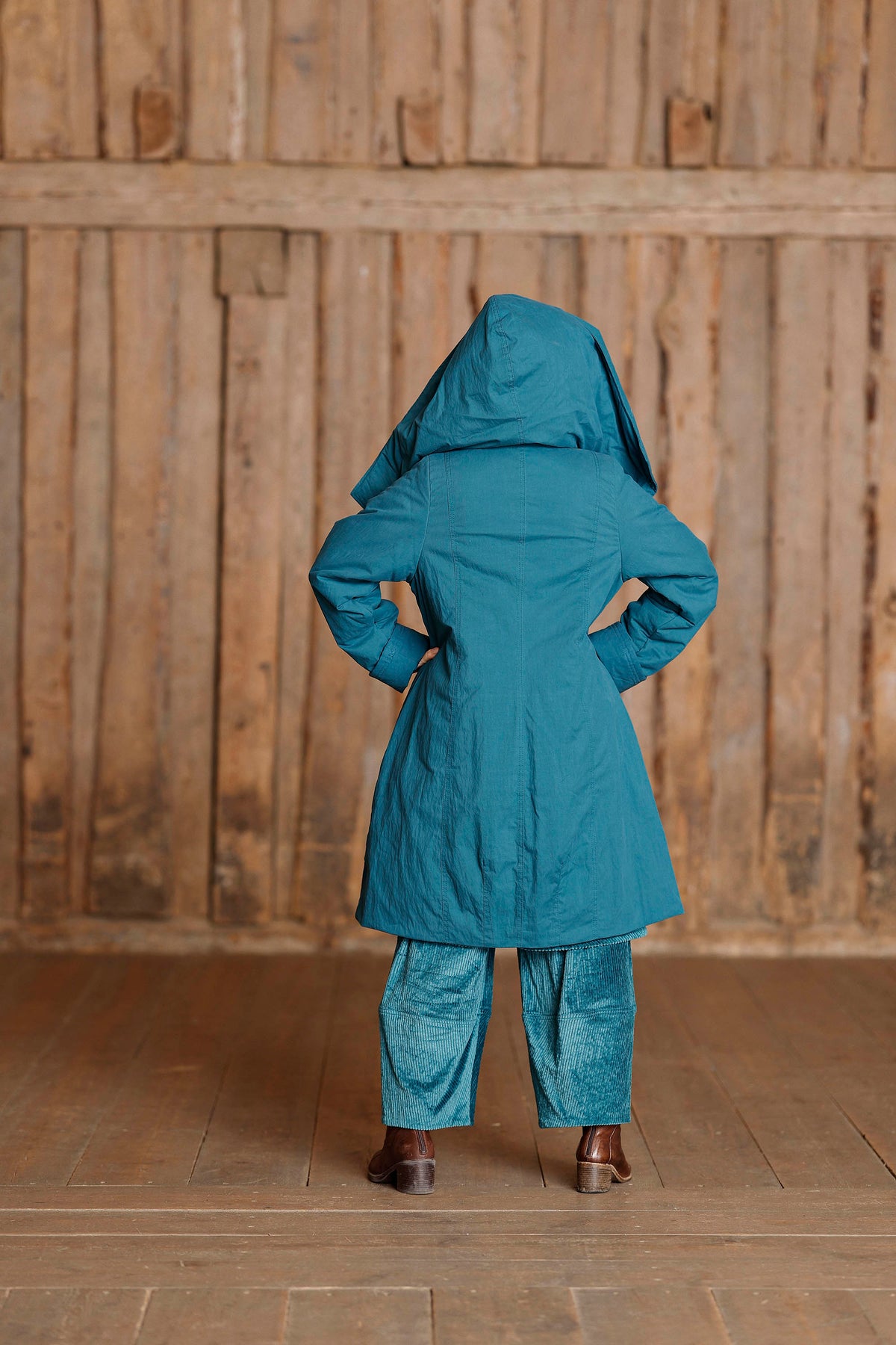 Petrol coat with asymmetric zipper