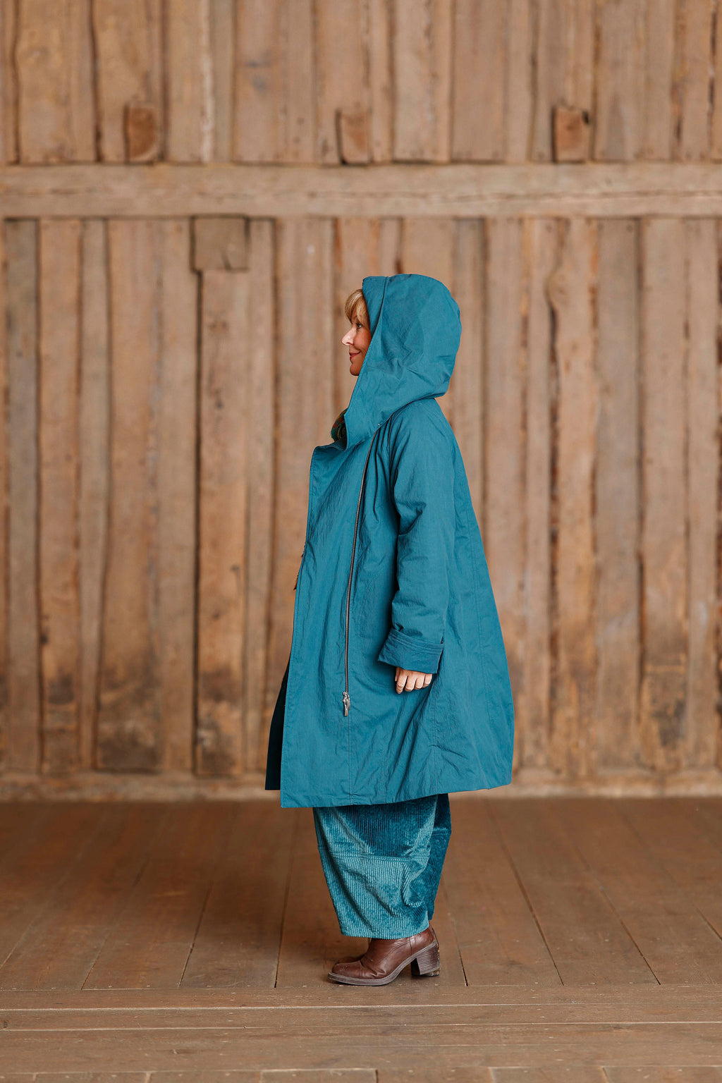 Petrol coat with asymmetric zipper