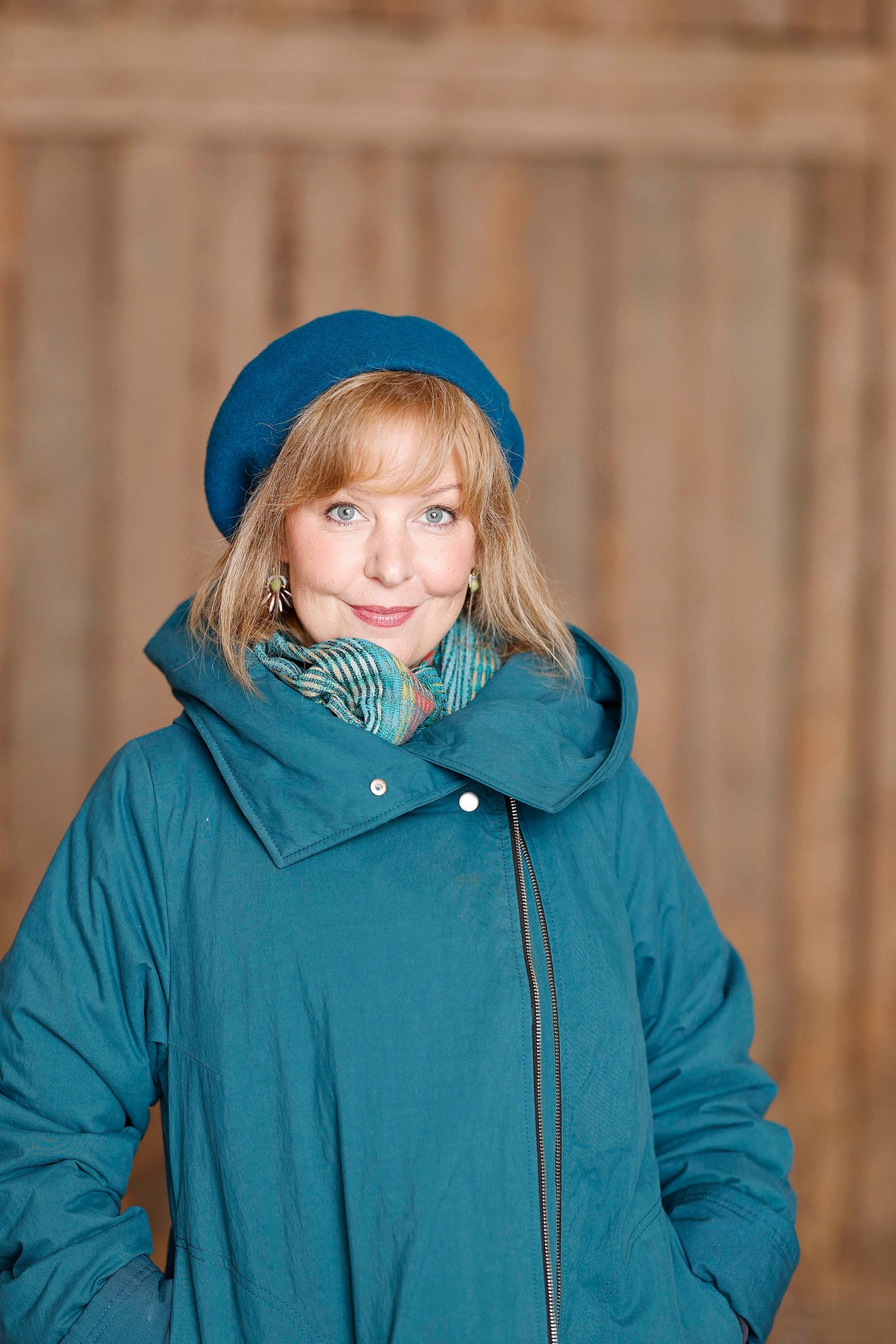 Petrol coat with asymmetric zipper