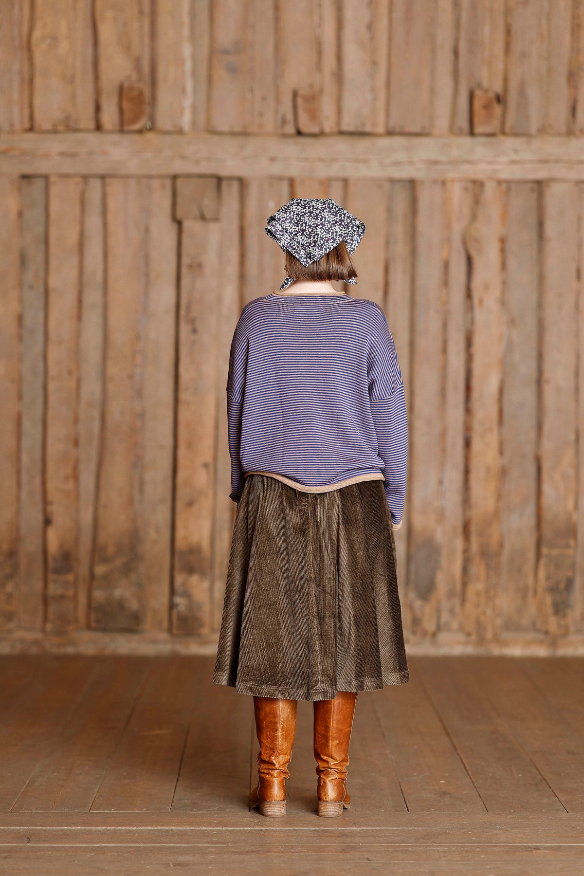 Long-sleeved knit from MUSE WEAR with narrow camel and blue stripes