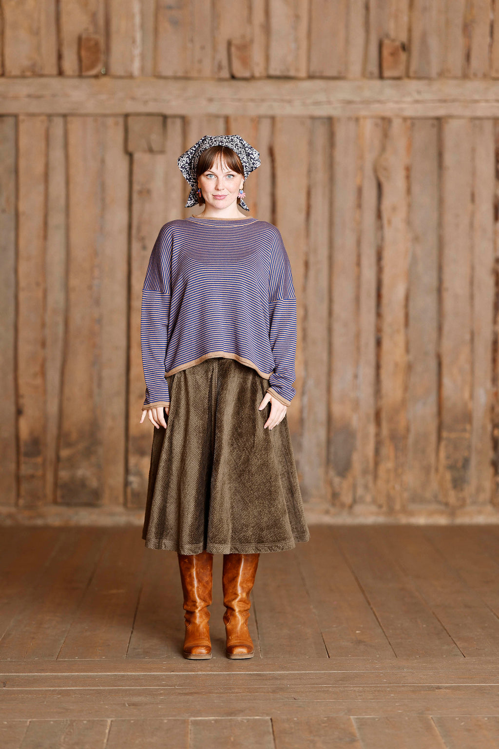 Long-sleeved knit from MUSE WEAR with narrow camel and blue stripes