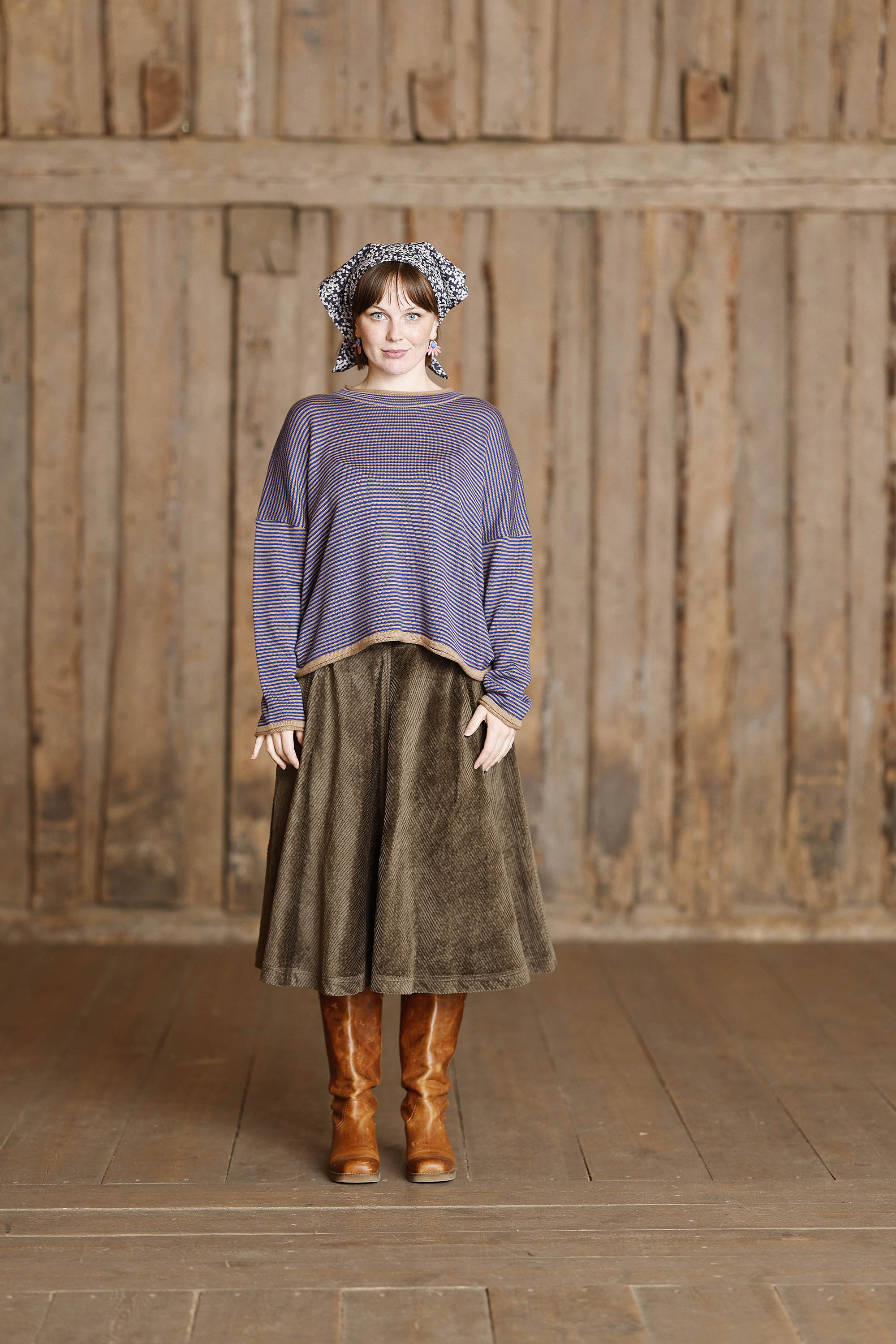 Long-sleeved knit from MUSE WEAR with narrow camel and blue stripes