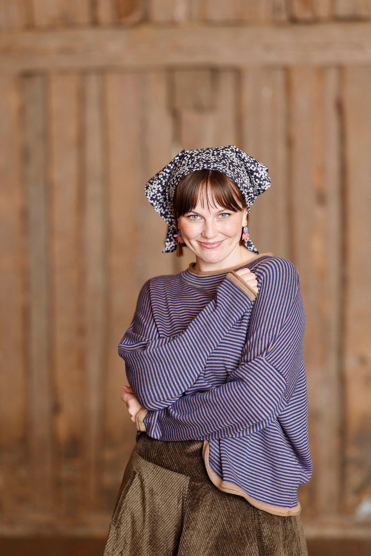 Long-sleeved knit from MUSE WEAR with narrow camel and blue stripes