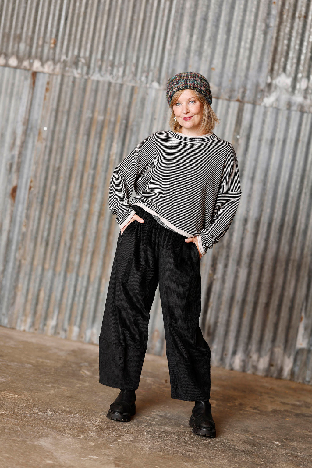 Long-sleeved knit from MUSE WEAR with narrow off-white and black stripes