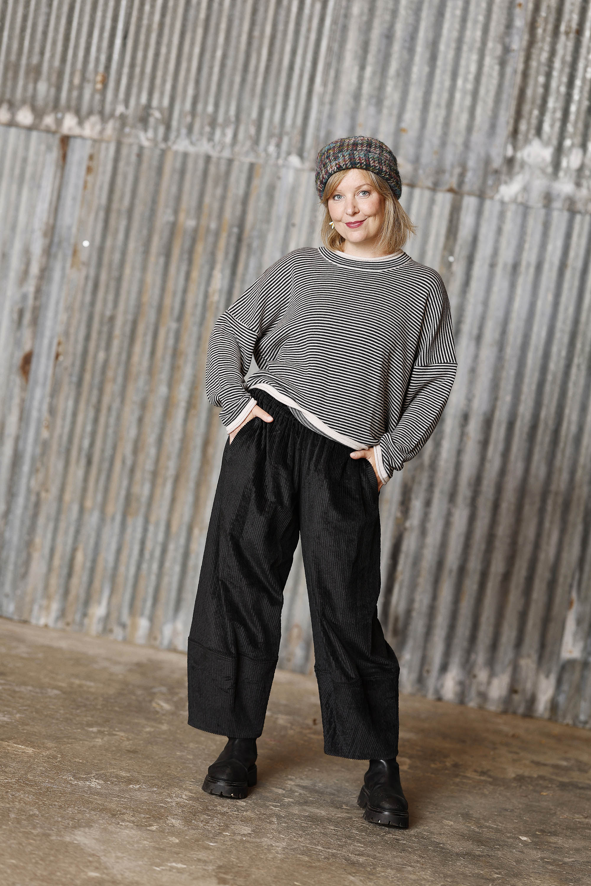 Long-sleeved knit from MUSE WEAR with narrow off-white and black stripes