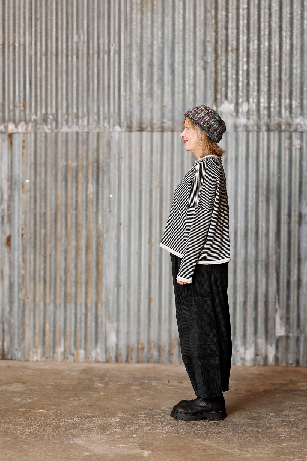 Long-sleeved knit from MUSE WEAR with narrow off-white and black stripes