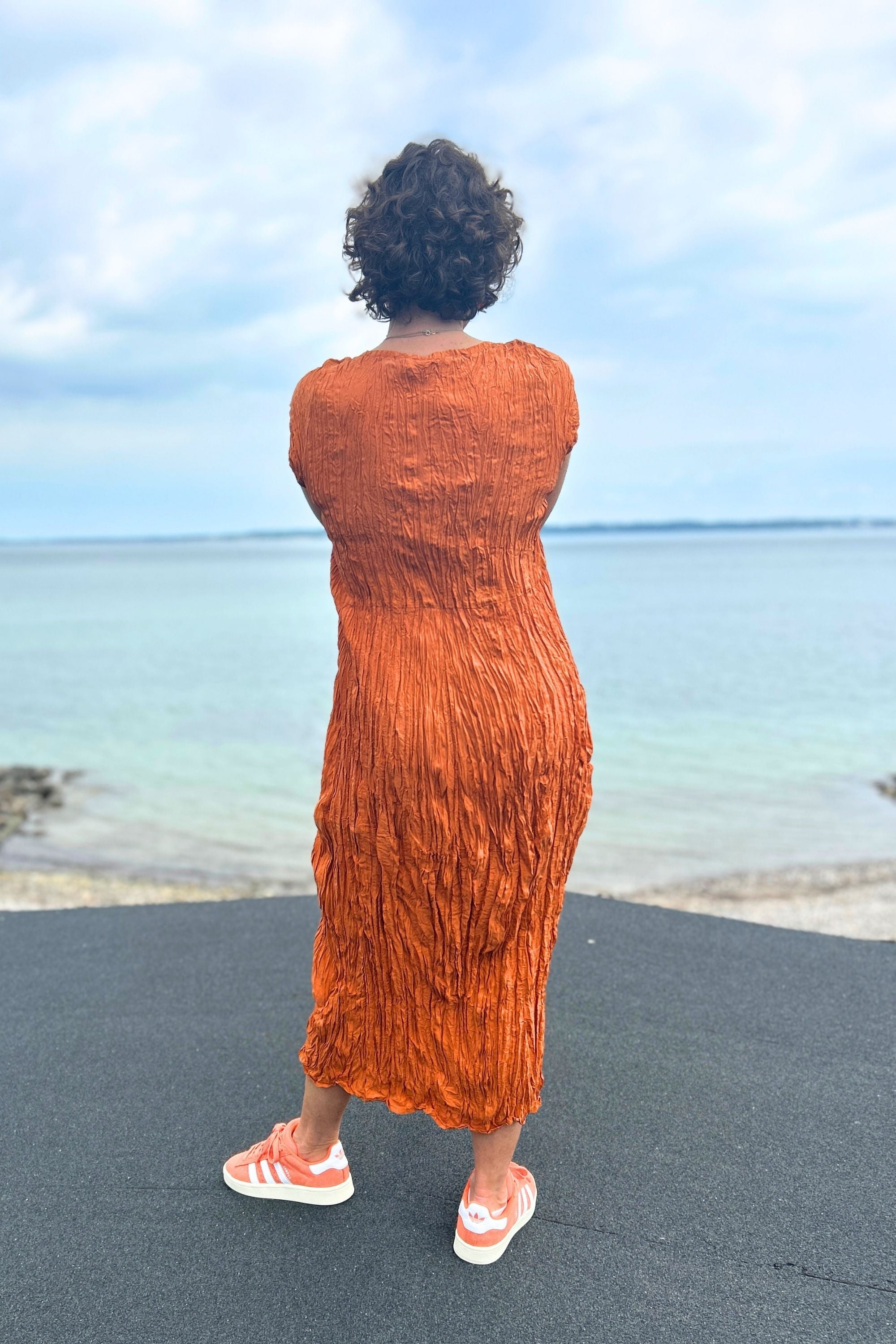 Orange-colored crinkled silk dress from Privatsachen