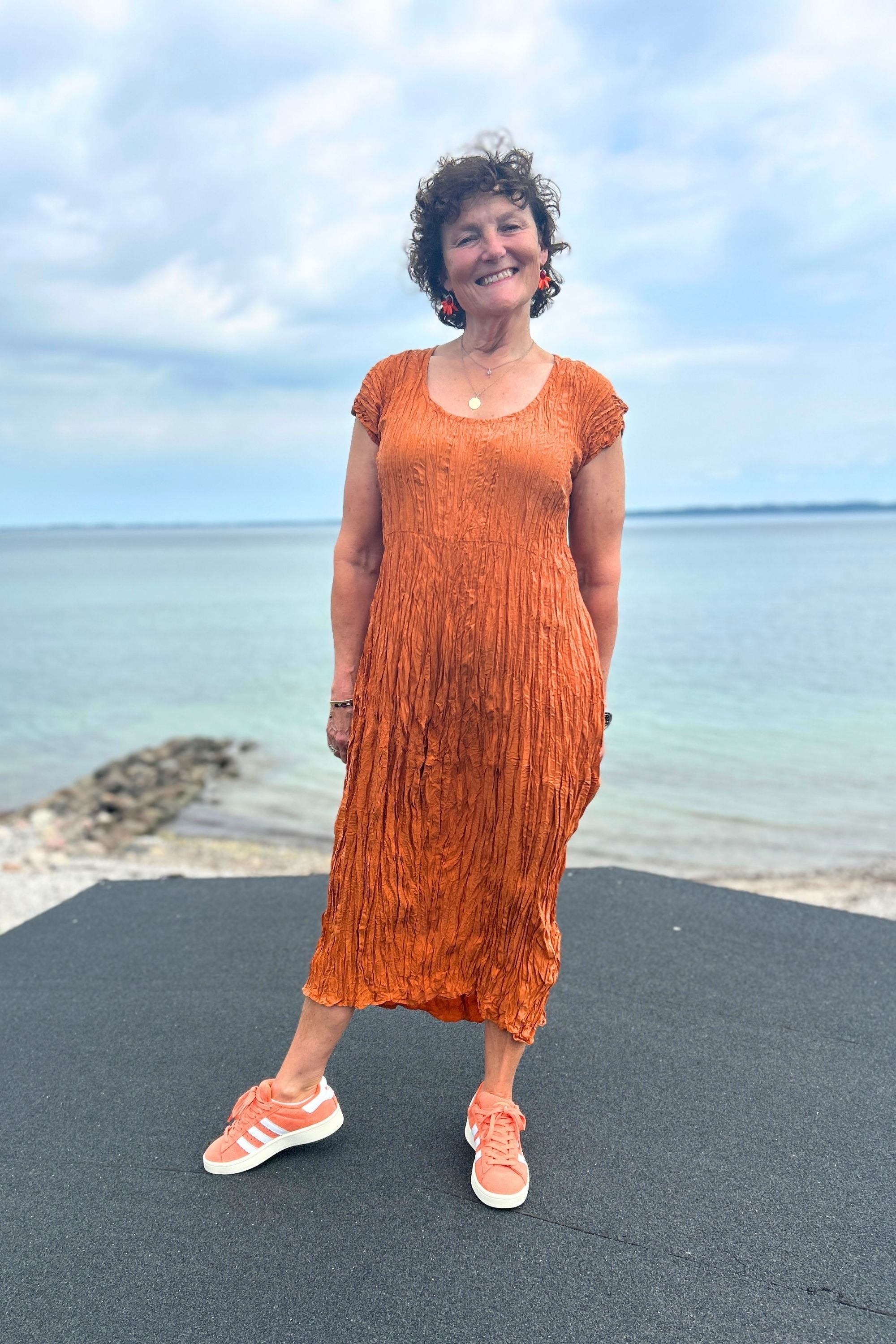 Orange-colored crinkled silk dress from Privatsachen