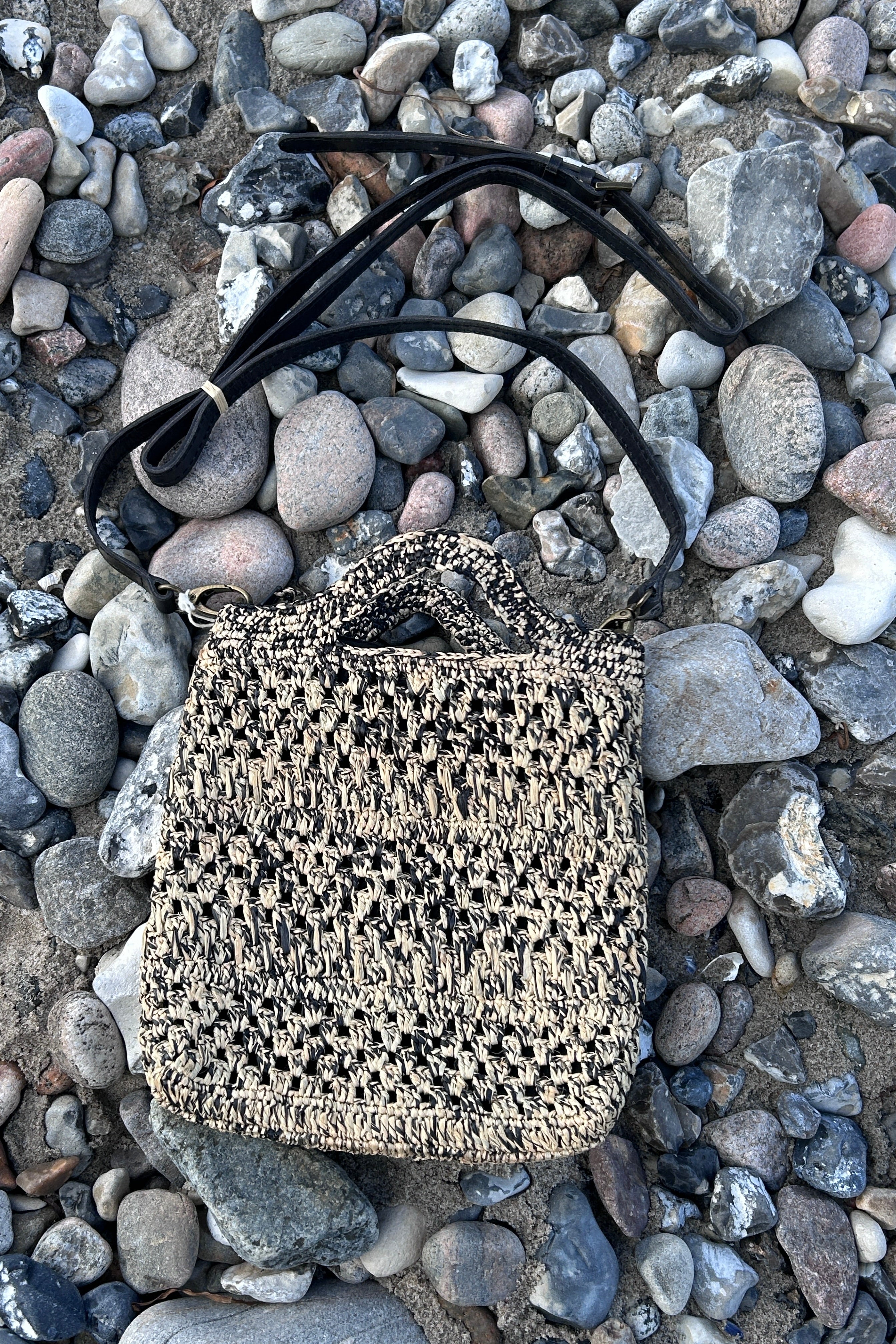 Small, stylish crossover bag in black and natural colors