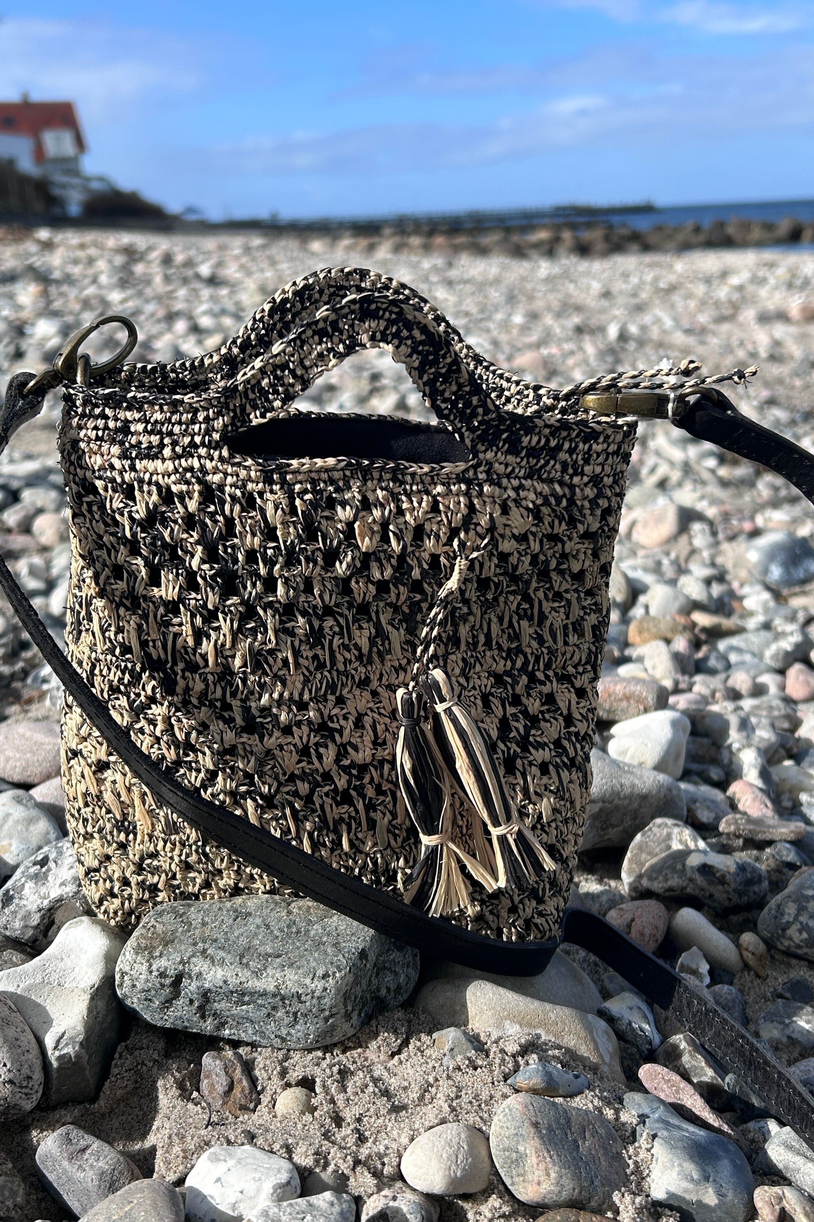 Small, stylish crossover bag in black and natural colors