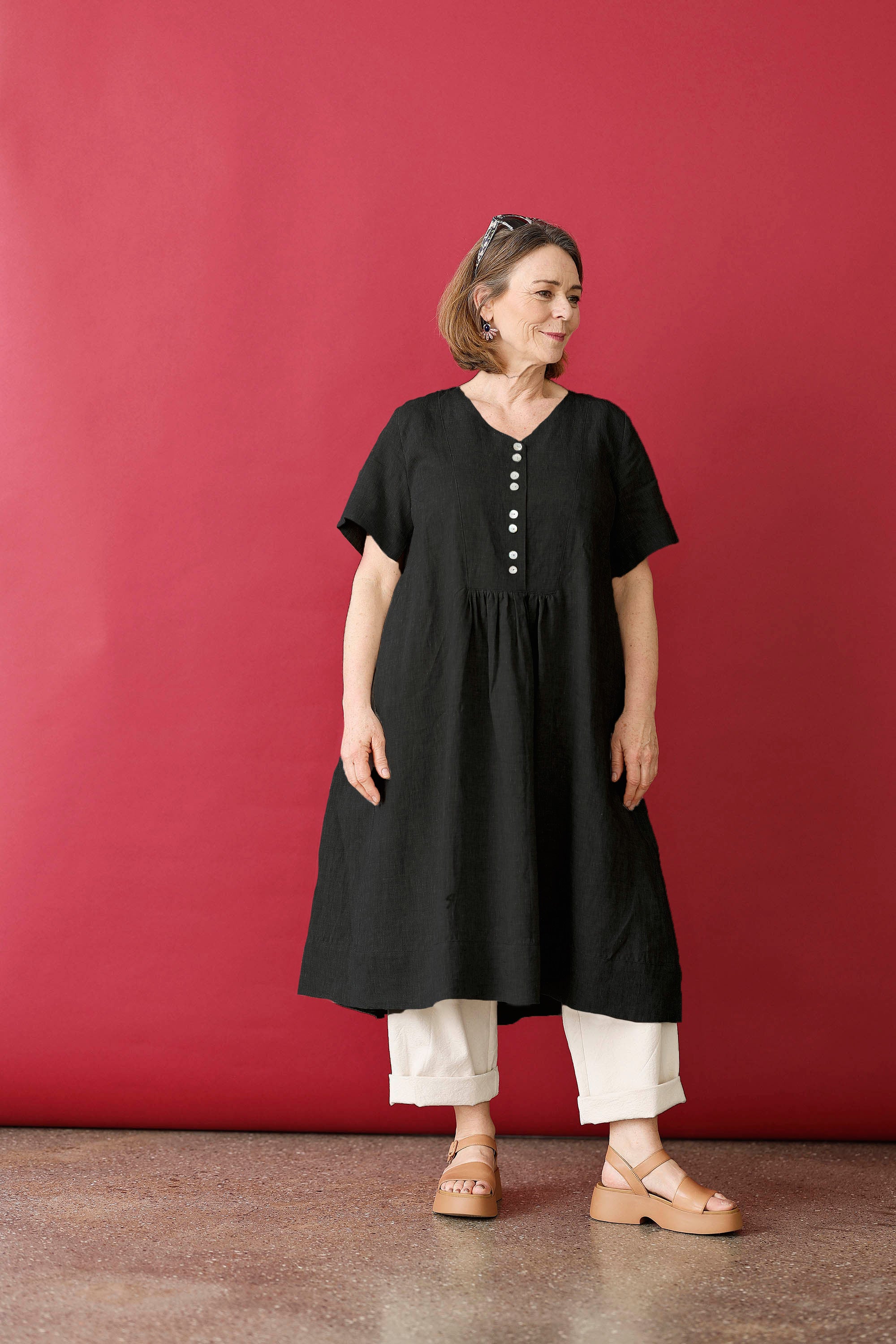 Feminine black colour linen dress with buttons.