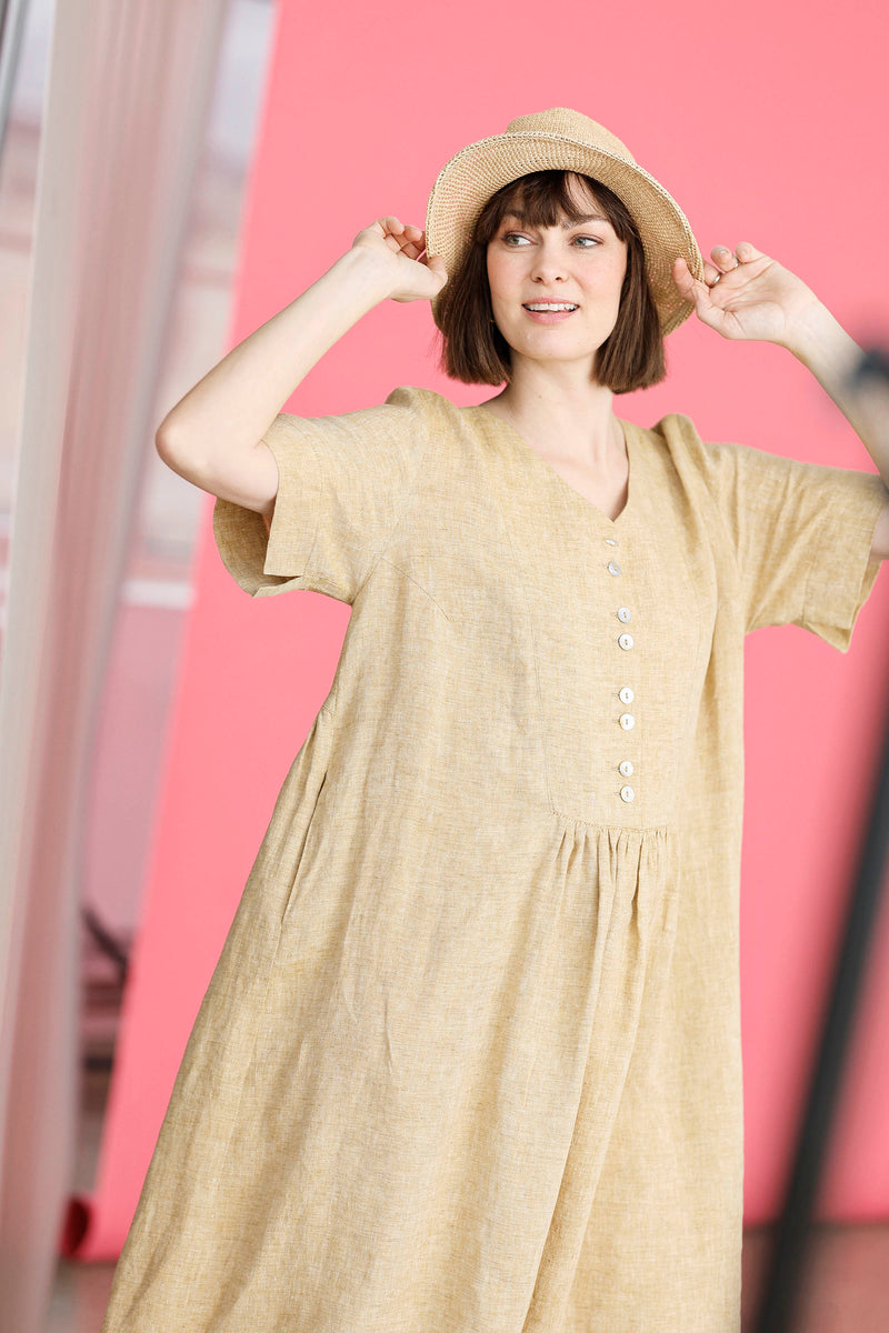 Lovely pastel yellow linen dress with buttons.