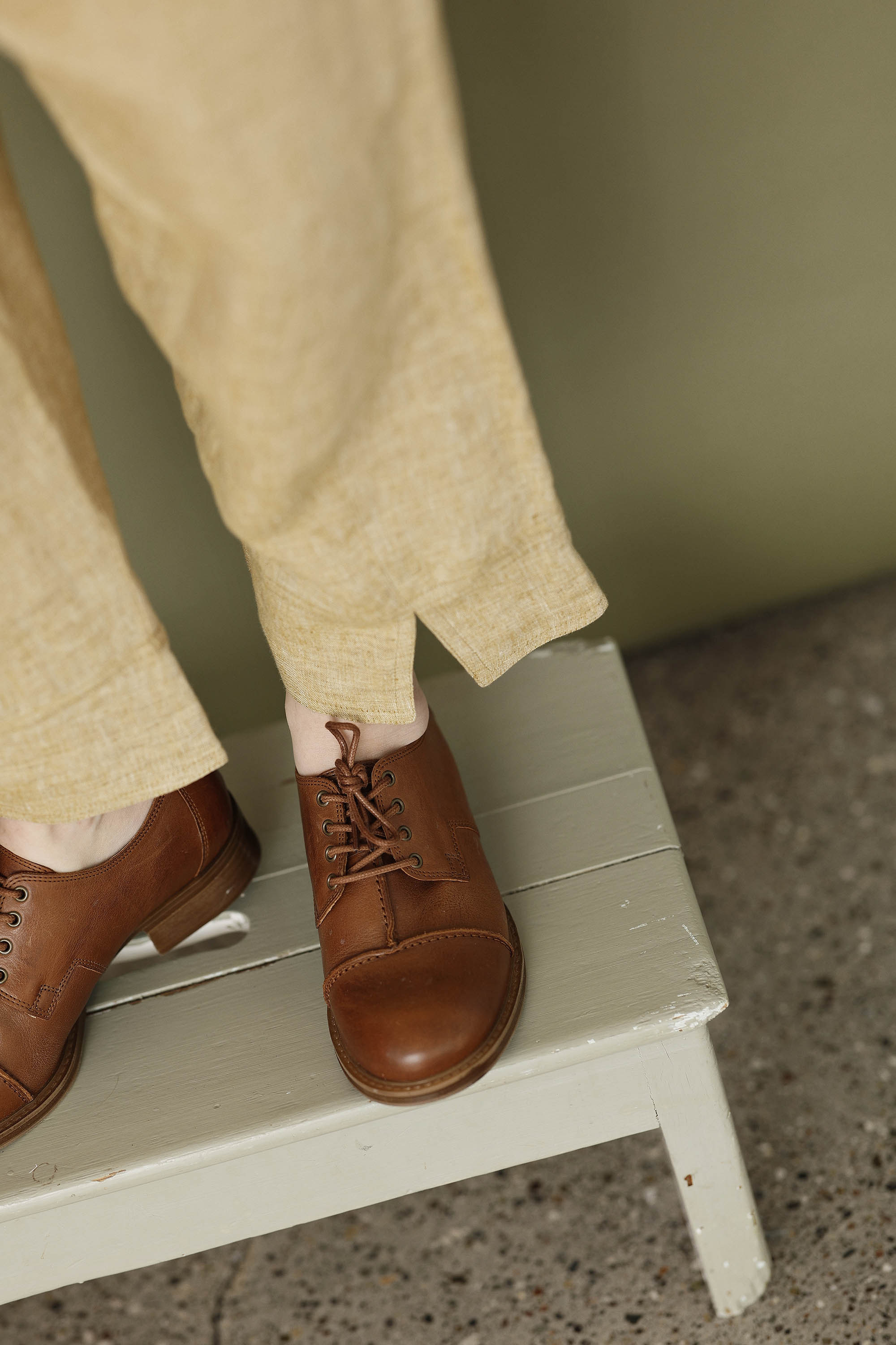 Pale yellow linen trousers with elastic waistband