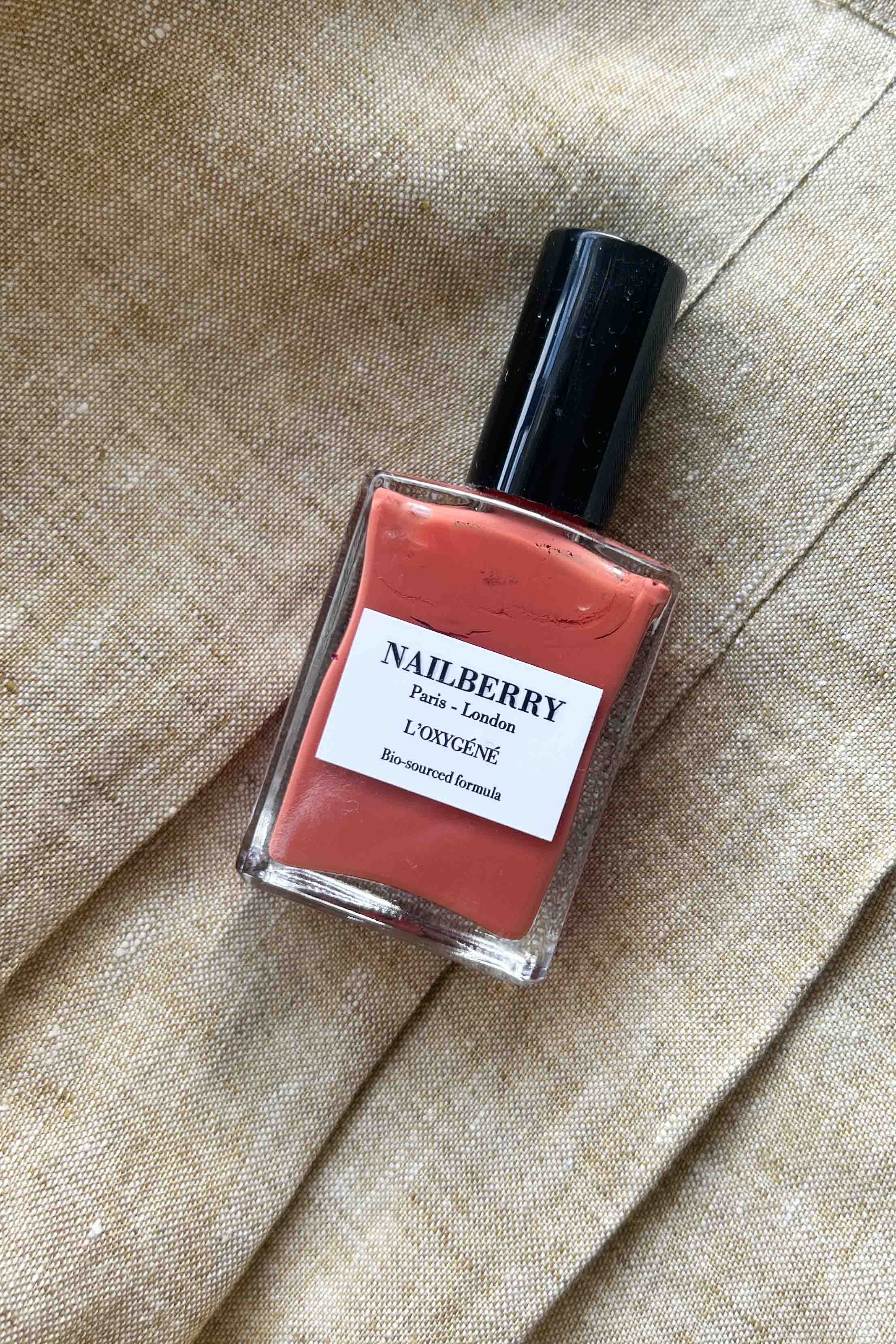 Nail polish in a dusty orange shade from Nailberry