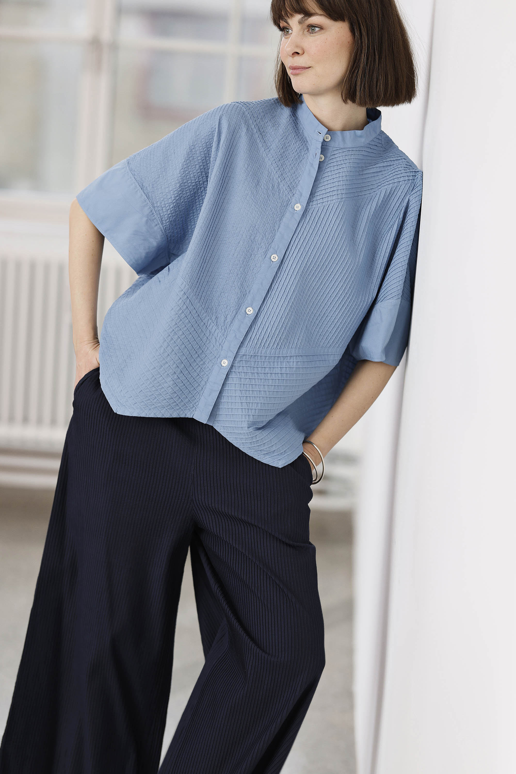 Bright steel blue short-sleeved, feminine YaccoMaricard shirt.