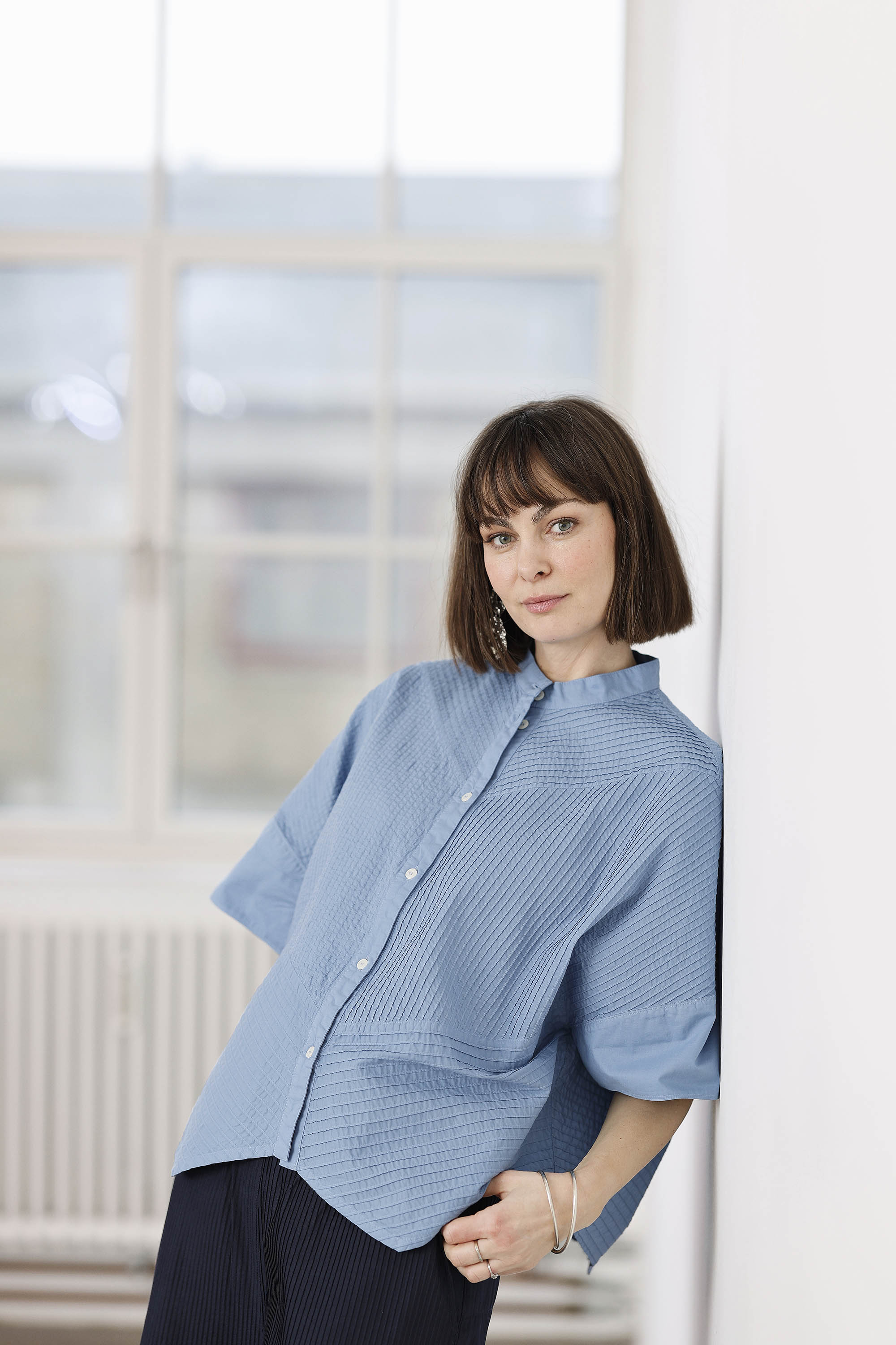 Bright steel blue short-sleeved, feminine YaccoMaricard shirt.