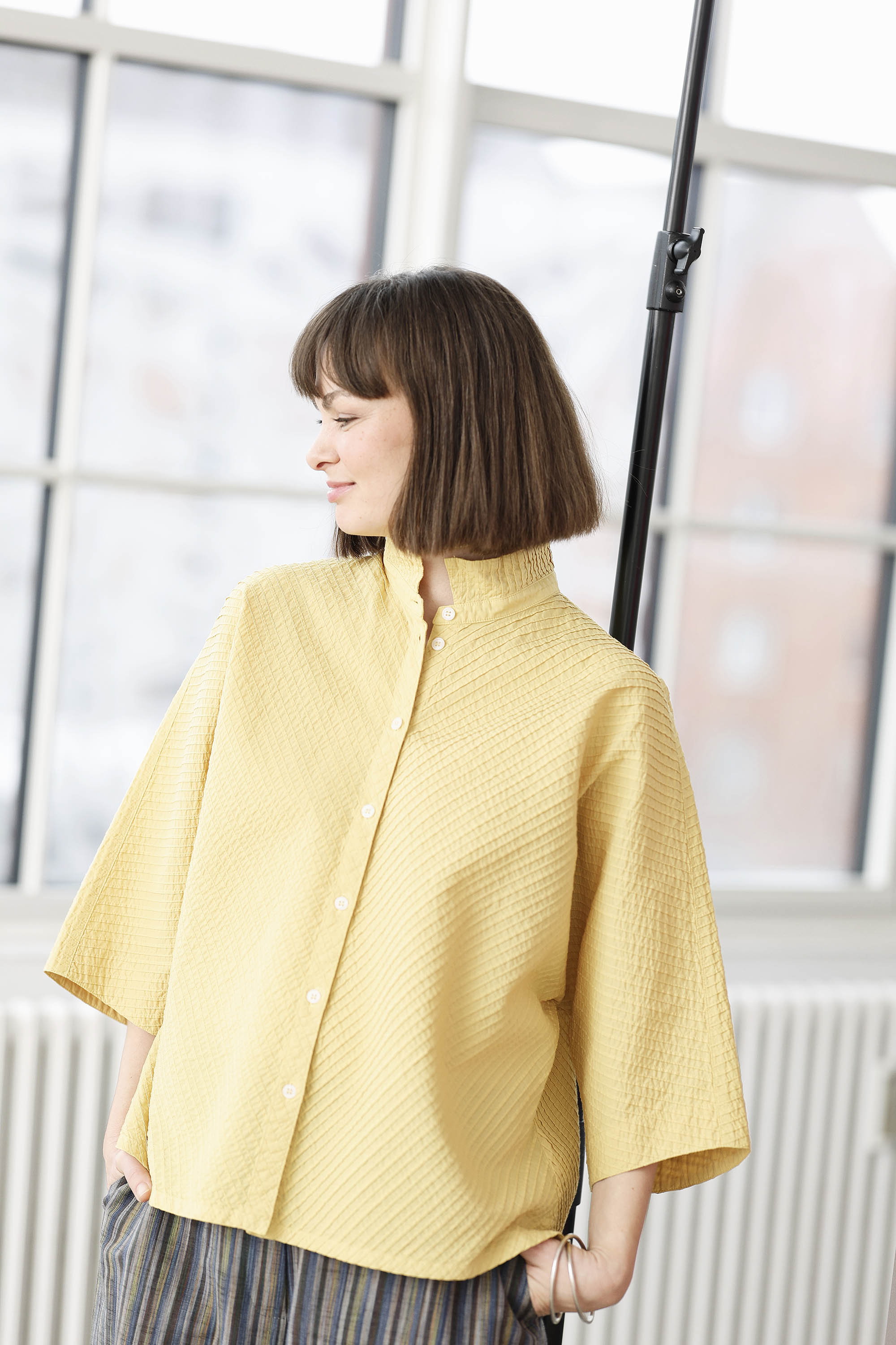 Yellow YaccoMaricard shirt with batwing sleeves.