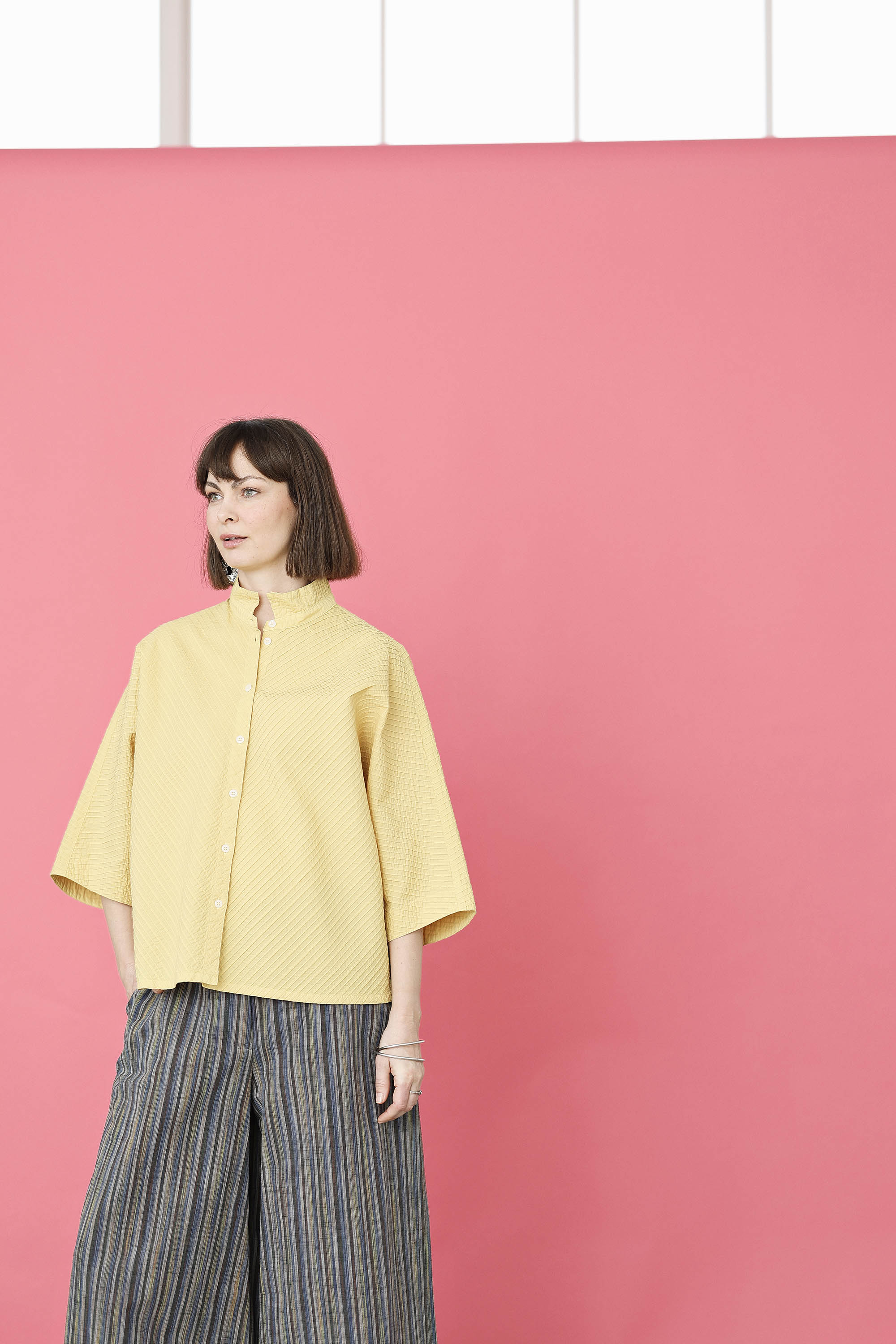Yellow YaccoMaricard shirt with batwing sleeves.