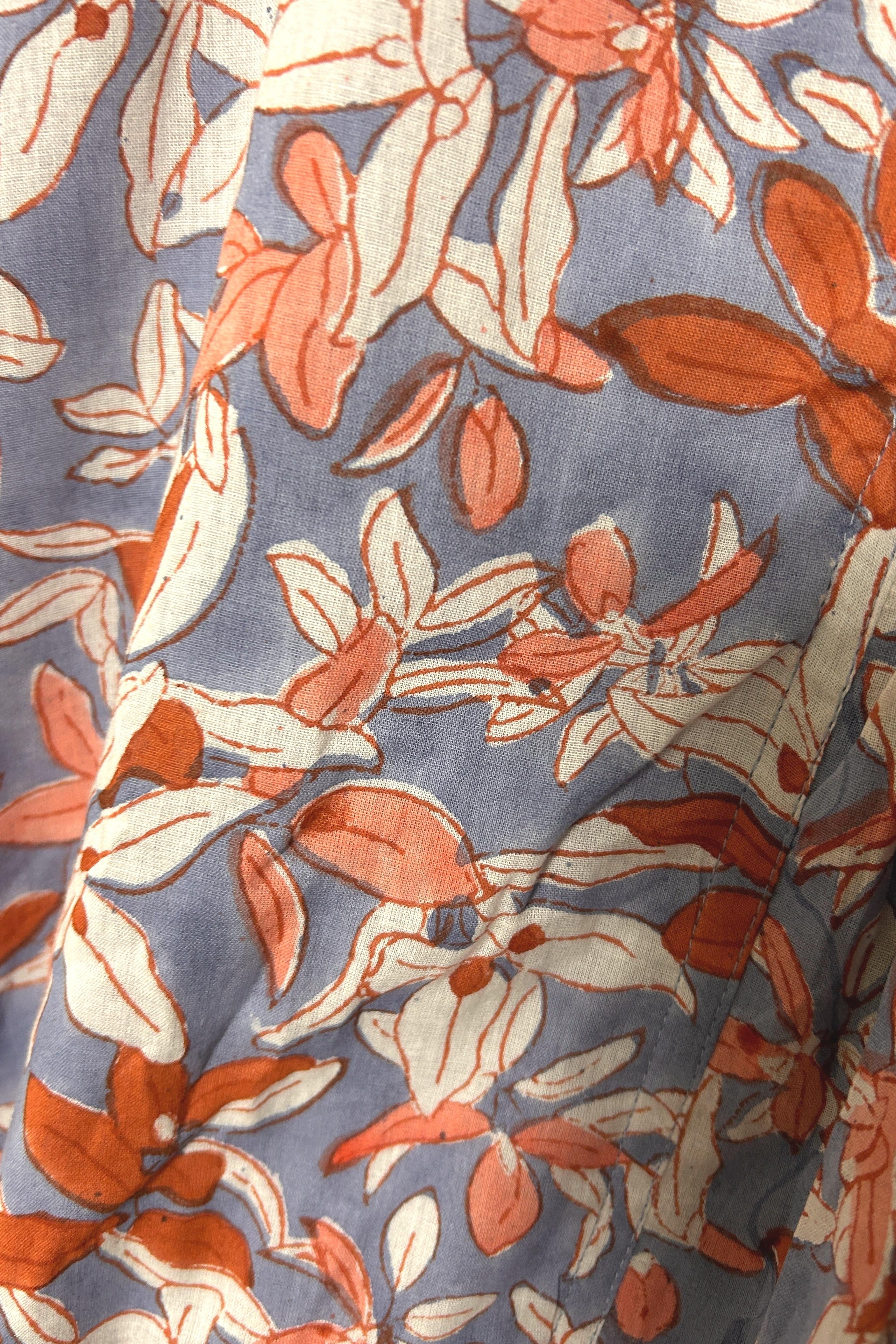 Purple summer dress with ruching and white floral print