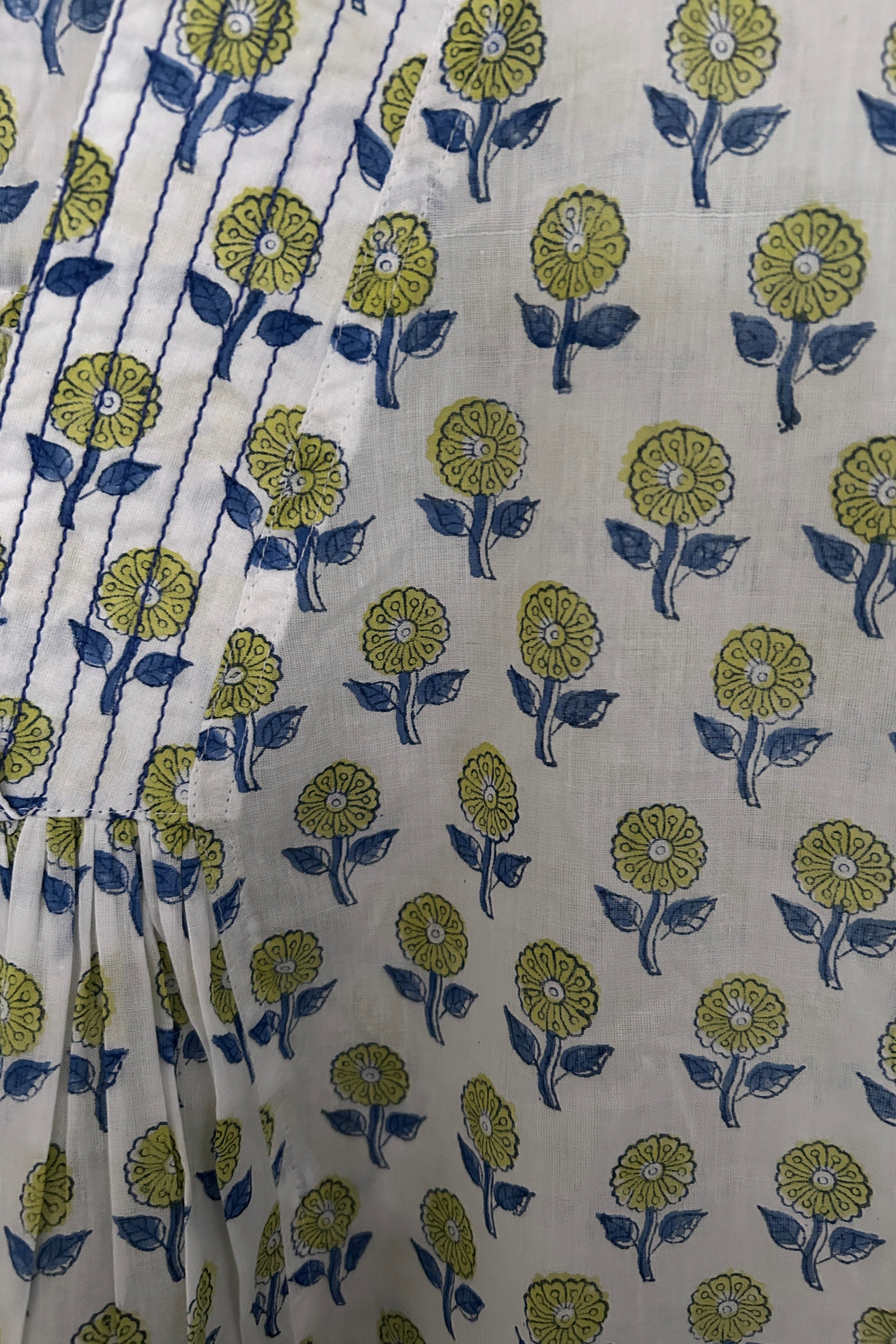 White summer top with graphic blue floral print