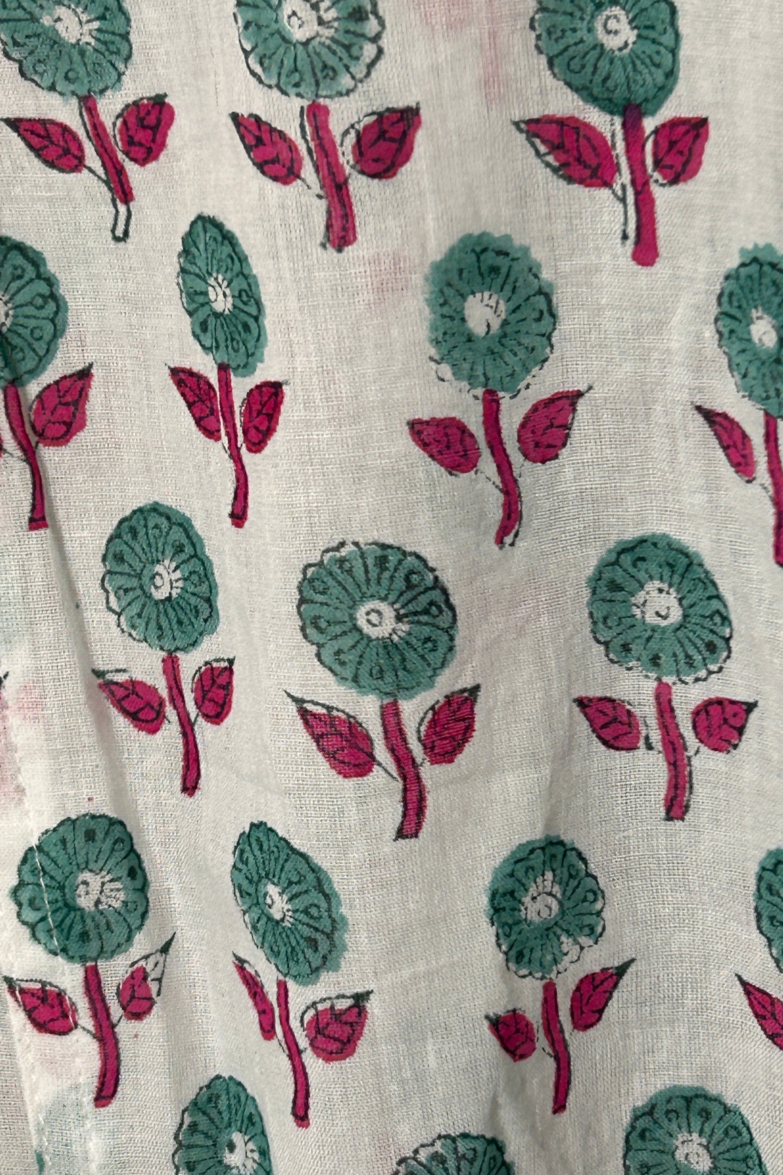 White summer top with graphic green floral print